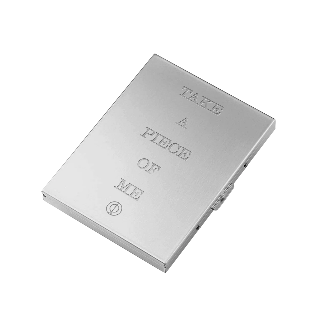 Silver metal box with engraved text reading 'Take a Piece of Me' across the back