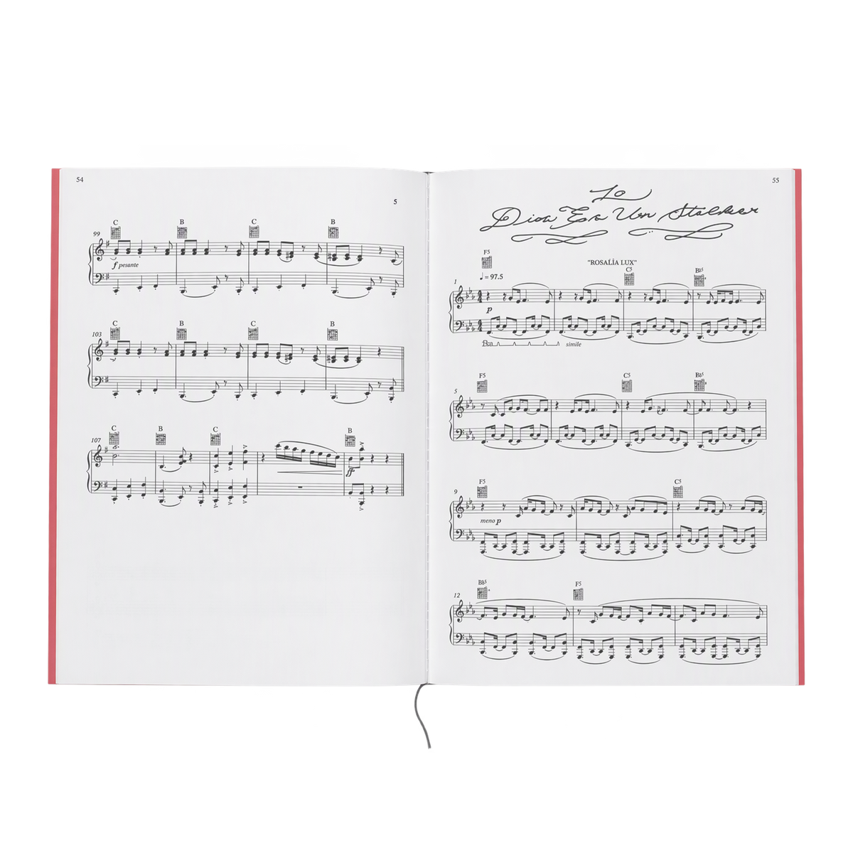 An open songbook showing a two-page spread of piano sheet music. The right page begins the song “Dios Es Un Stalker” with a handwritten-style title and a “Rosalía LUX” credit. Both pages have grand-staff piano notation with guitar chord diagrams above the staves. The book has red edges and a grey ribbon bookmark, shown against a black-and-grey checkered background.