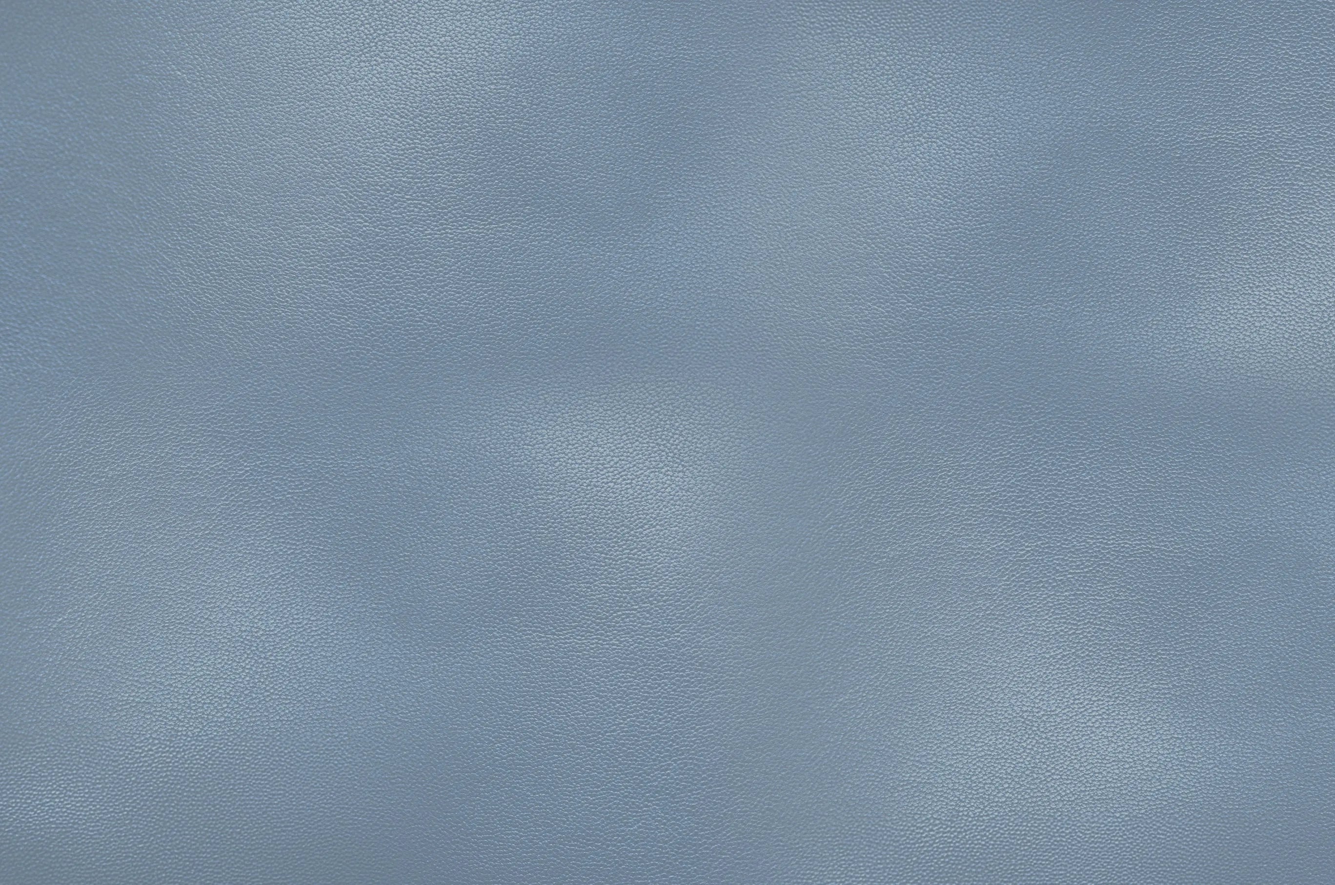 Close-up of a sky blue leather surface showing natural grain and subtle texture details.