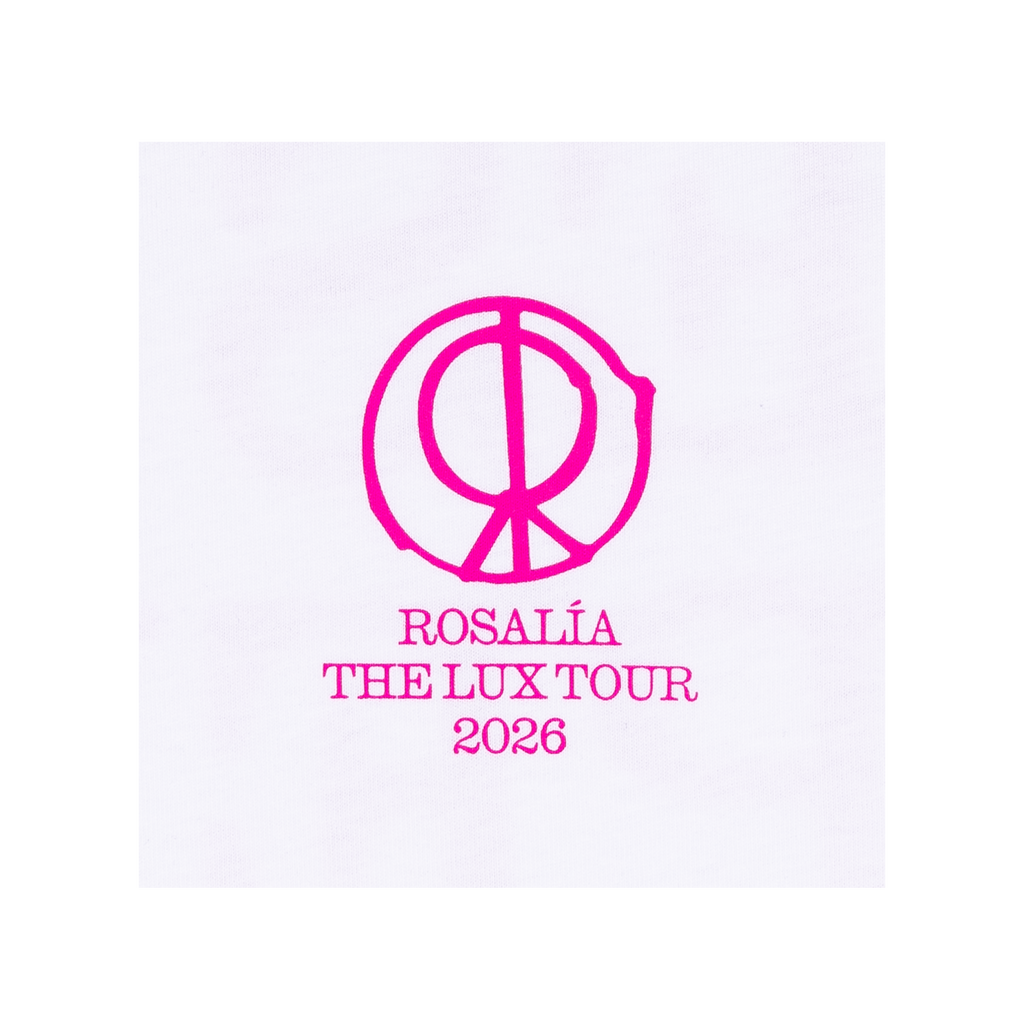 Close-up view of a white T-shirt featuring a bright pink “LUX” logo printed on the front, with text underneath reading “Rosalia The Lux Tour 2026.”