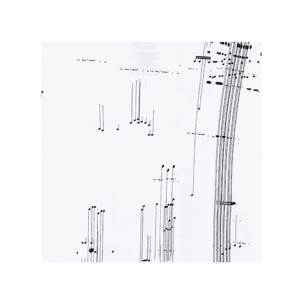 Close-up of a tank top print showing abstract black and white musical notes pattern